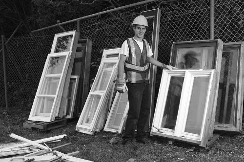 Team member preparing documents for an office clearance in Sydenham, with accessible signage visible